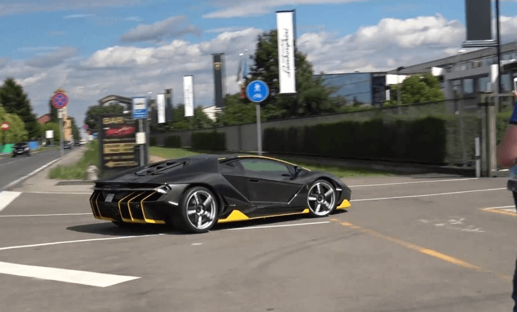 driving supercar on road