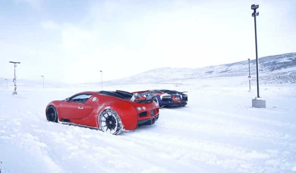 supercar riding on snow in winter